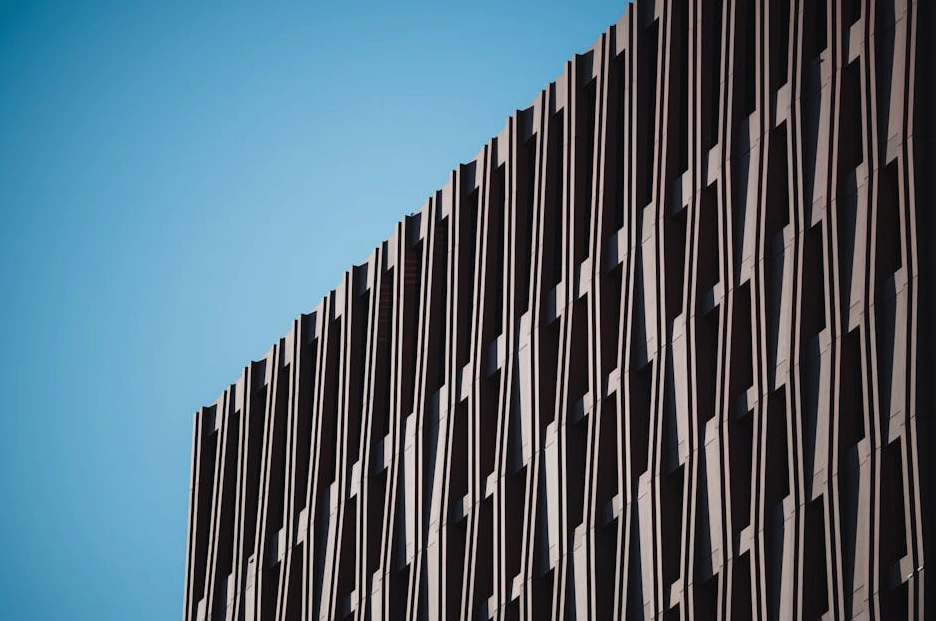 Modern architectural building with strong geometric lines, representing business structure.